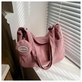 Detailed macro view of pink corduroy tote bag with round FANYISSA coin purse pendant - Pink With Small Pouch