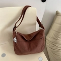 Brown corduroy crossbody bag with front pockets and cute white dog charm on chair - Dark Brown With Charm