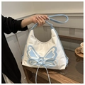 Detail of white butterfly handbag featuring blue lace-up embroidery and PU leather texture - White and Blue