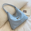 Light blue nylon shoulder bag with a silver butterfly buckle and side chain detail - Blue