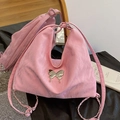 Pink cloud-textured crossbody bag featuring a silver butterfly metallic ornament - Pink