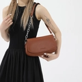 Caramel brown leather saddle bag with silver chain strap and fashion logo - Brown