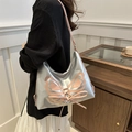 Silver shoulder bag with pink leather butterfly decor and lace-up details on model - Pink and Silver