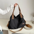 Grande borsa tote in tela nera con manici marroni e tracolla regolabile per donna - Nero