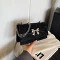 Glossy black shoulder bag with silver bow and metal chain strap for women - Black