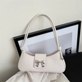 Chic beige matte leather baguette underarm bag with silver metal bow and knot strap detail - White