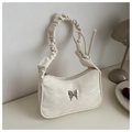 Close-up of off-white ruched strap bag with silver butterfly buckle and marble texture - White