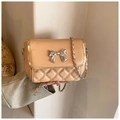 Quilted beige crossbody bag featuring silver butterfly buckle and leather chain strap - White