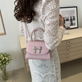 Pink mini crossbody square bag with a silver metal bow buckle and elegant top handle - Pink