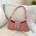 Pink faux leather baguette bag featuring a silver bow detail with sparkling rhinestones - Pink
