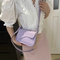 Chic lavender square crossbody bag with wave-edge flap and gold chain detail - Purple