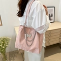 Pink marble pattern tote bag with silver butterfly charm and pearl chain detail - Pink