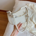 Cream white underarm bag with pearl chain, silver heart charms, and knotted handle - Beige