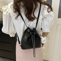 Versatile black bucket backpack with chain strap and cute plush charm on white top - Black (With Glasses Pendant)