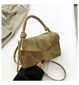 Detailed macro view of olive green retro canvas square bag with knotted handle and metal hardware - Khaki
