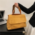 Ginger yellow suede tote bag with brown fabric strap in a professional office setting - Brown
