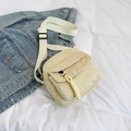 Beige corduroy crossbody bag with adjustable strap and textured zipper puller - Off-white