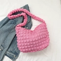 Chic pink popcorn textured shoulder bag for women displayed on denim jacket - Rose Pink