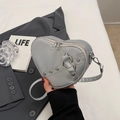 Light grey heart-shaped crossbody bag with decorative buckle strap and silver studs - Silver