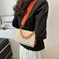 Straw woven shoulder bag with floral embroidery and vibrant orange acrylic chain strap - Orange