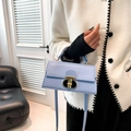 Minimalist light blue leather crossbody square bag with a gold metal lock and shoulder strap - Blue