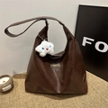 Dark brown tote bag in matte PU leather with a fuzzy star charm and front logo detail - Coffee + White Plush Charm