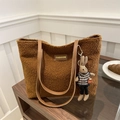 Brown fuzzy plush tote bag with leather straps and cute bunny charm on a wood table - Rabbit Keychain / Brown