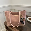 Pink plush tote bag with leather strap and cute rabbit pendant on a wooden shelf - Rabbit Keychain / Pink