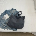 Minimalist deep grey-blue nylon tote bag with drawstring side detail and waterproof texture - Gray