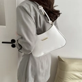 Minimalist white faux leather underarm bag with gold hardware and knotted shoulder strap - White