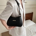 Minimalist black hobo shoulder bag with gold metal buckle and knotted strap detail - Black