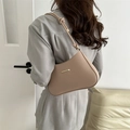 Minimalist beige leather shoulder bag with gold metal trim and stylish knotted strap design - Khaki