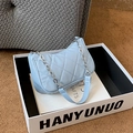 Light blue quilted baguette bag with silver chain and leather shoulder strap - Blue