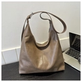 Detail of vintage tote bag showing soft leather texture and adjustable strap buckle - Khaki