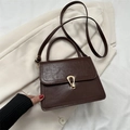 Retro dark brown PU leather handbag with gold U-shaped lock on light background - Dark Brown