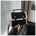 Chic black leather handbag with white faux fur trim and elegant gold hardware - Black