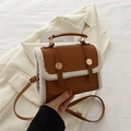 Vintage brown leather crossbody bag with white faux fur trim and gold buckle details - Brown