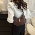 Minimalist dark brown crescent shoulder bag with golden geometric clasp closure - Brown