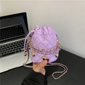 Elegant purple quilted bucket bag with golden heart charms and dual chain straps - Purple