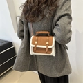 Vintage brown leather crossbody bag with white shearling trim and golden buckle detail - Brown and White