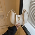 Minimalist beige half-moon underarm bag with gold metal buckle and matte leather finish - White