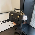 Chic black mini square bag in smooth leather with a cute white plush monster charm - Black with White Plush Charm