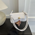 White faux leather crocodile pattern handbag with knotted handle and gold buckle - White