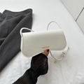 White faux crocodile leather crossbody bag with elegant gold lettering and knotted strap - White