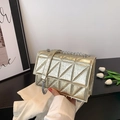 Quilted gold patent leather crossbody bag with silver chain strap and flap closure - Gold