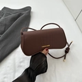 Dark brown crocodile embossed baguette bag with gold metal logo and long strap - Brown