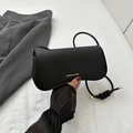 Chic black crocodile textured crossbody bag with gold lettering and knotted shoulder strap - Black