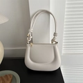Beige faux leather hobo bag with unique 3D curved embossed patterns and knotted handle - White