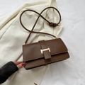 Elegant dark coffee leather crossbody bag featuring a classic gold H-shaped metal clasp - Brown