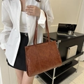 Vintage brown PU leather tote bag with retro cloud texture shown on a female model - Brown